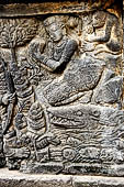 Prambanan - Ramayana reliefs of Shiva Temple. Detail of the panel where Rama shoots a crocodile who is transformed into a celestial nymph.  